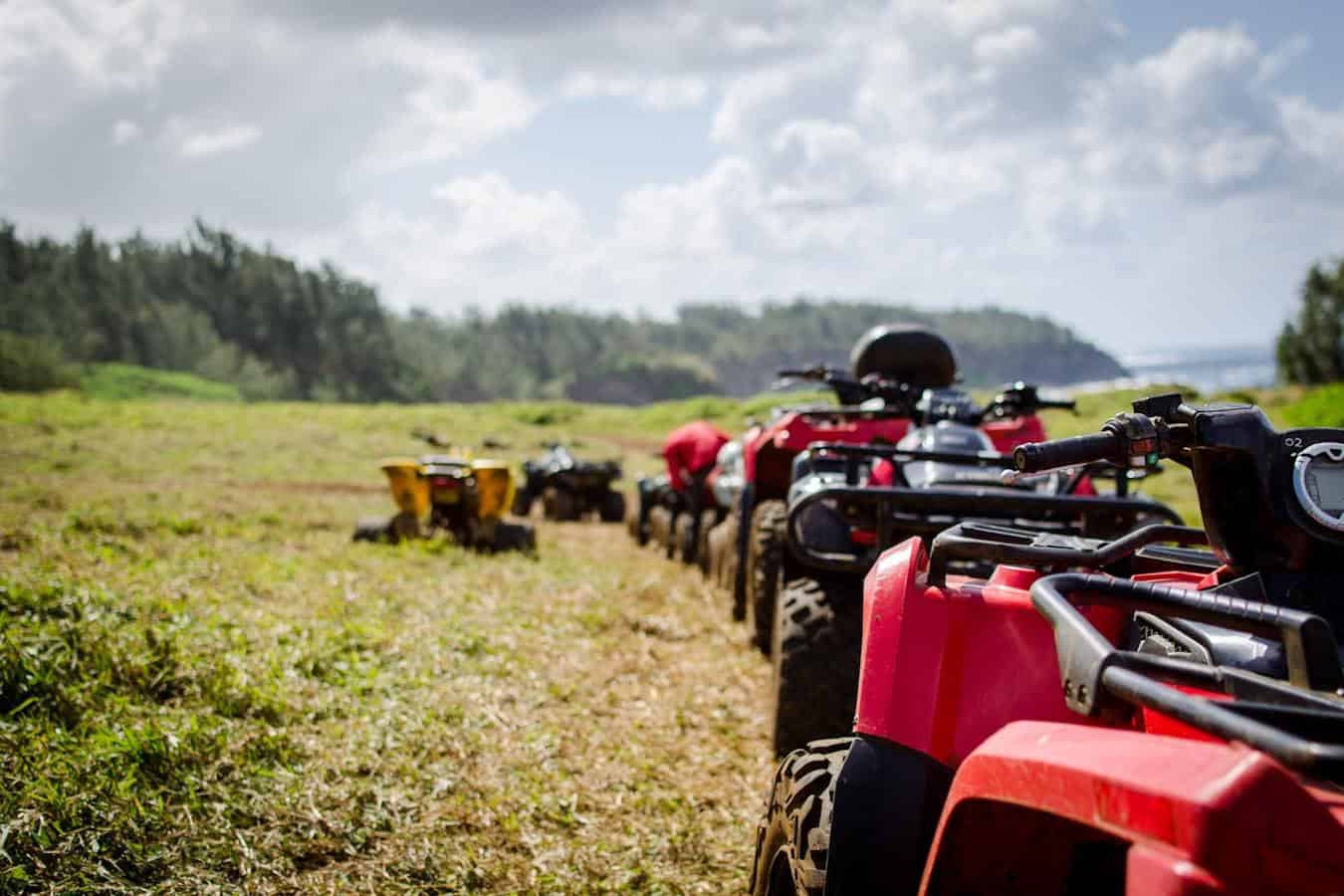 ATVs in a row in a field