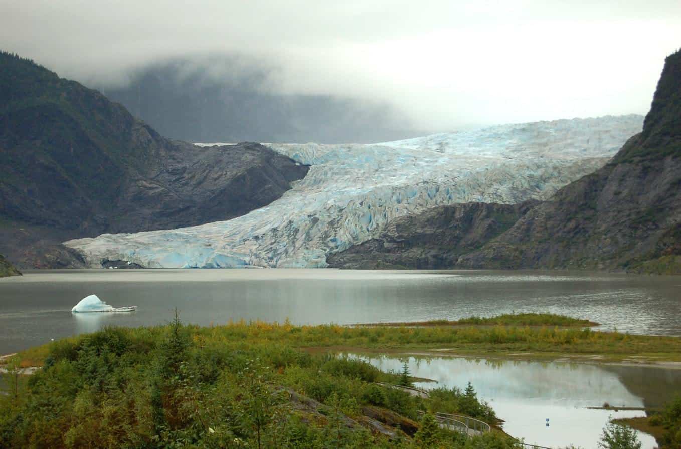 Glacier feeding into small lake in Alaska.