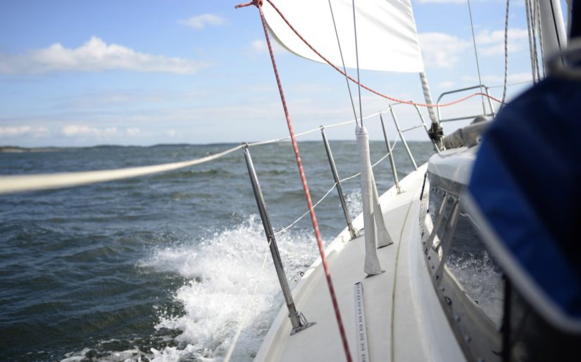 Sailboat operating at a safe speed for the wind and water conditions.